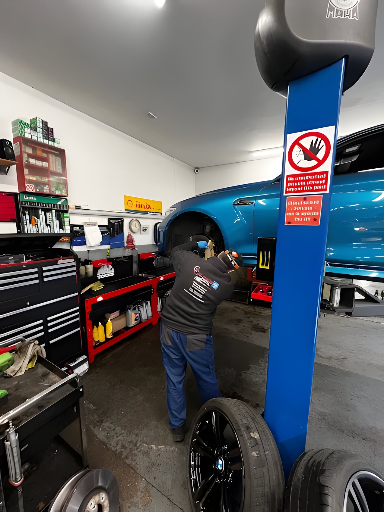 Technician carrying out underbody and suspension work